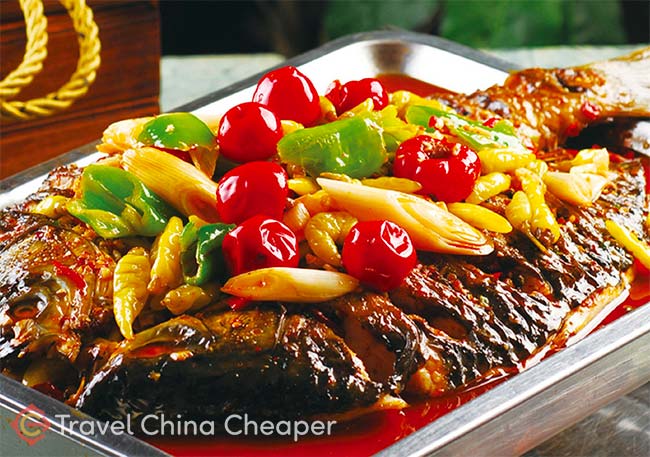 Try Chongqing Fried Fish (重庆烤鱼), a popular Chinese food for tourists